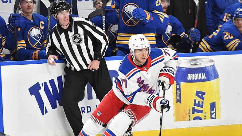 Jan 26, 2021; Buffalo, New York, USA; New York Rangers defenseman Tony DeAngelo (77) handles the puck in the third period against the Buffalo Sabres at KeyBank Center. Mandatory Credit: Mark Konezny-USA TODAY Sports