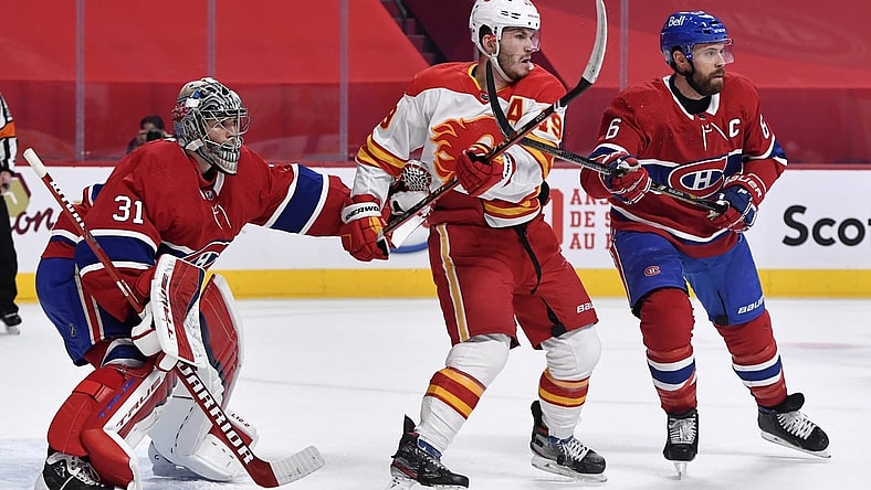 Jan 28, 2021; Montreal, Quebec, CAN; Montreal Canadiens goalie Carey Price (31) and teammate Shea Weber (6) deal with Calgary Flames forward Matthew Tkachuk (19) in front of the net during the first period at the Bell Centre. Mandatory Credit: Eric Bolte-USA TODAY Sports