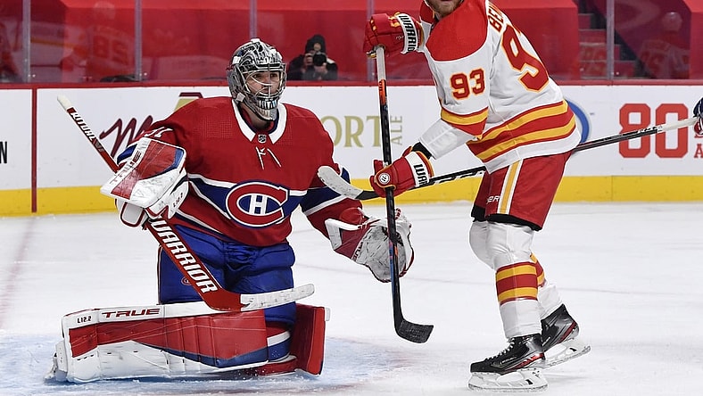 Jan 28, 2021; Montreal, Quebec, CAN; Calgary Flames forward Sam Bennett (93) screens Montreal Canadiens goalie Carey Price (31) during the third period at the Bell Centre. Mandatory Credit: Eric Bolte-USA TODAY Sports