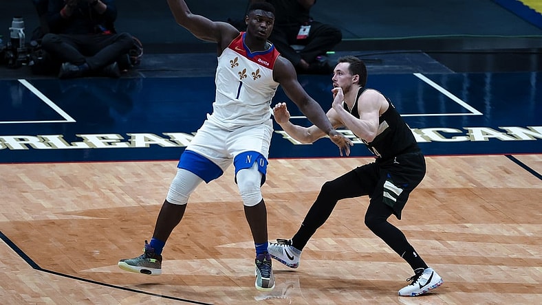 Jan 29, 2021; New Orleans, Louisiana, USA;  New Orleans Pelicans forward Zion Williamson (1) is defended by Milwaukee Bucks guard Pat Connaughton (24) during the fourth quarter at the Smoothie King Center. Mandatory Credit: Derick E. Hingle-USA TODAY Sports