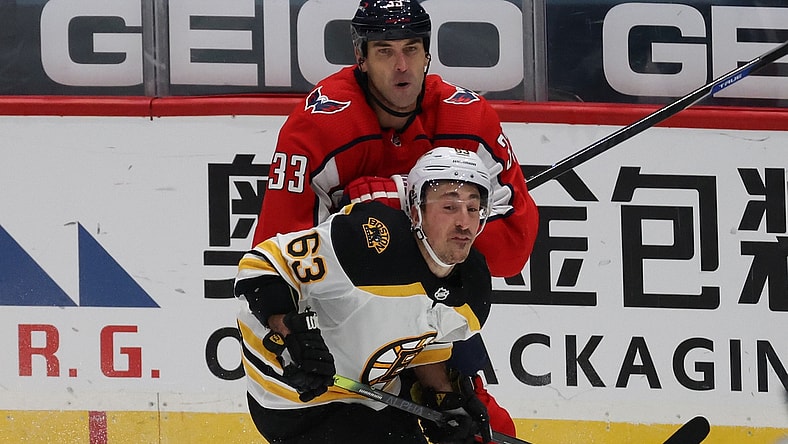 Jan 30, 2021; Washington, District of Columbia, USA; Washington Capitals defenseman Zdeno Chara (33) checks Boston Bruins left wing Brad Marchand (63) in the first period at Capital One Arena. Mandatory Credit: Geoff Burke-USA TODAY Sports