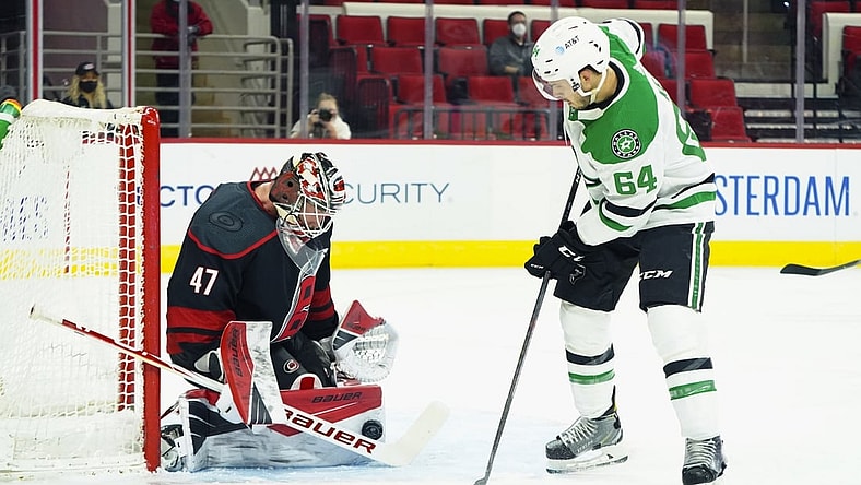 Jan 30, 2021; Raleigh, North Carolina, USA;  Carolina Hurricanes goaltender James Reimer (47) stops a first period shot against Dallas Stars center Tanner Kero (64) at PNC Arena. Mandatory Credit: James Guillory-USA TODAY Sports