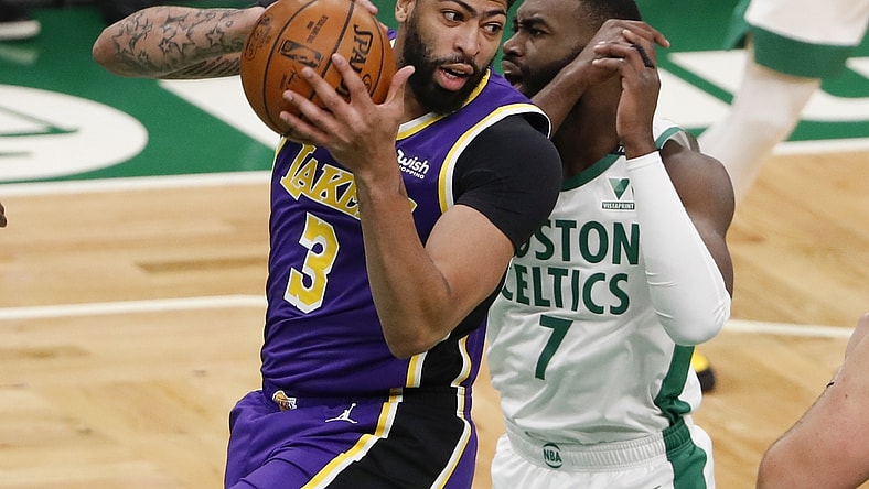 Jan 30, 2021; Boston, Massachusetts, USA; Los Angeles Lakers forward Anthony Davis (3) grabs a rebound from Boston Celtics guard Jaylen Brown (7) during the first quarter at TD Garden. Mandatory Credit: Winslow Townson-USA TODAY Sports