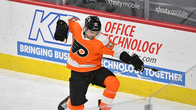 Jan 30, 2021; Philadelphia, Pennsylvania, USA;  Philadelphia Flyers left wing Scott Laughton (21) celebrates his game-winning goal during overtime against the New York Islanders at Wells Fargo Center. Mandatory Credit: Eric Hartline-USA TODAY Sports