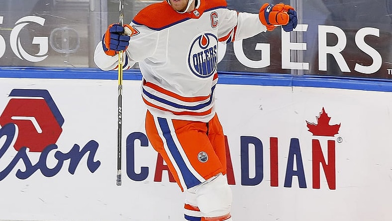 Jan 30, 2021; Edmonton, Alberta, CAN; Edmonton Oilers forward Connor McDavid (97) celebrates his overtime winning goal against the Toronto Maple Leafs at Rogers Place. Mandatory Credit: Perry Nelson-USA TODAY Sports