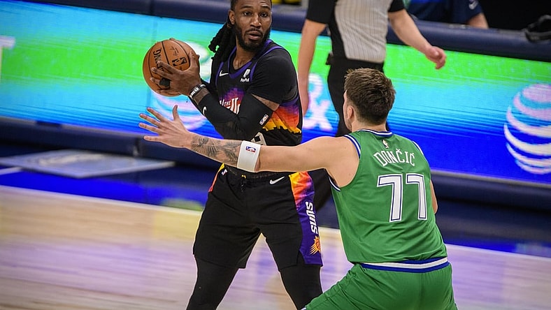 Jan 30, 2021; Dallas, Texas, USA; Dallas Mavericks guard Luka Doncic (77) guards Phoenix Suns forward Jae Crowder (99) during the second quarter at the American Airlines Center. Mandatory Credit: Jerome Miron-USA TODAY Sports