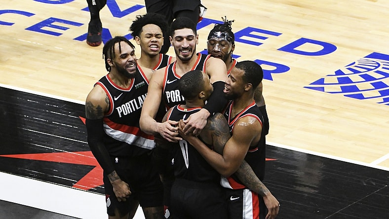 Jan 30, 2021; Chicago, Illinois, USA; Portland Trail Blazers guard Damian Lillard (0) celebrates with his teammates after making the game winning three point basket at the buzzer against the Chicago Bulls during the second half at United Center. Mandatory Credit: David Banks-USA TODAY Sports