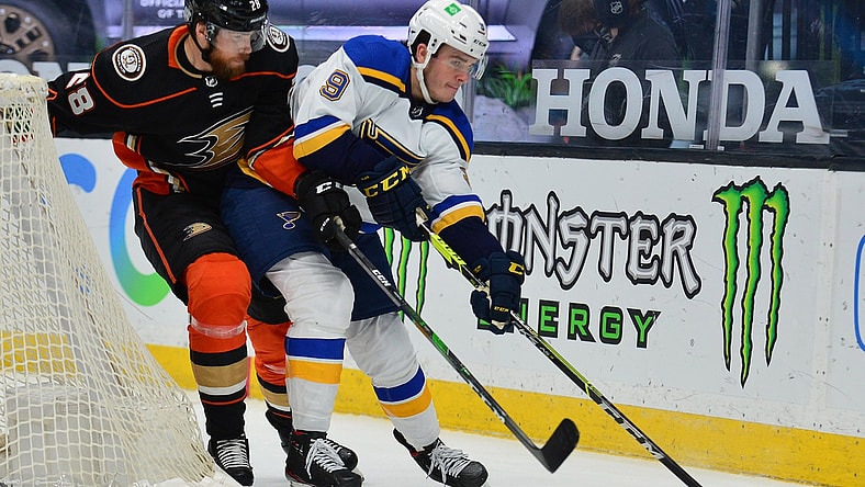 Jan 31, 2021; Anaheim, California, USA; St. Louis Blues left wing Sammy Blais (9) moves the puck against Anaheim Ducks defenseman Jani Hakanpaa (28) during the second period at Honda Center. Mandatory Credit: Gary A. Vasquez-USA TODAY Sports