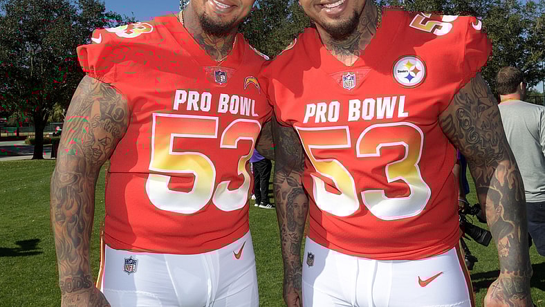 Jan 25, 2019; Kissimmee, FL, USA; Twin brothers and centers Mike Pouncey of the Los Angeles Chargers (left) and Maurkice Pouncey of the Pittsburgh Steelers pose during AFC practice at ESPN Wide World of Sports Complex. Mandatory Credit: Kirby Lee-USA TODAY Sports