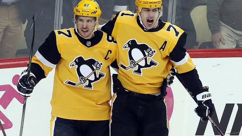 Mar 12, 2019; Pittsburgh, PA, USA;  Pittsburgh Penguins center Sidney Crosby (87) celebrates with center Evgeni Malkin (71) after scoring a goal against the Washington Capitals during the second period at PPG PAINTS Arena. Mandatory Credit: Charles LeClaire-USA TODAY Sports
