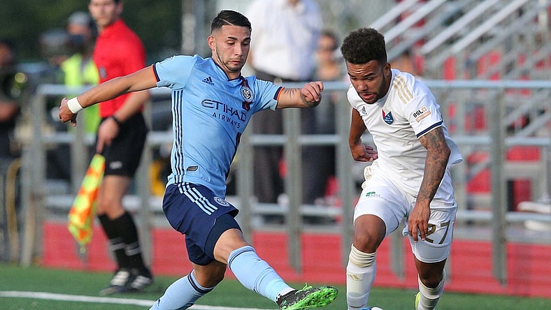 Jun 12, 2019; Queens, NY, USA; North Carolina FC defender DJ Taylor (27) plays the ball against New York City FC midfielder Valentin Castellanos (11) during the first half at Belson Stadium. Mandatory Credit: Brad Penner-USA TODAY Sports