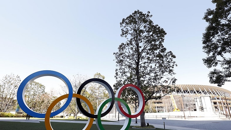 Mar 24, 2020; Tokyo, Japan; Olympic rings monument in front of National Stadium. On Monday the IOC announced that the Tokyo 2020 Summer Olympics Games would be postponed due to the COVID-19 coronavirus pandemic. Mandatory Credit: Yukihito Taguchi-USA TODAY Sports