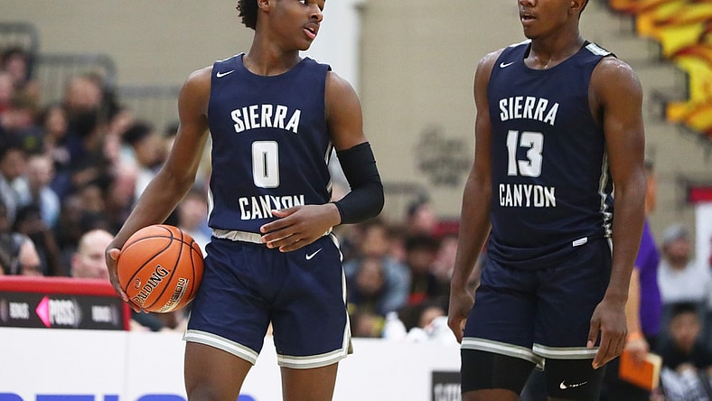 Dec 7, 2019; Scottsdale, AZ, USA; Sierra Canyon School guard LeBron James Jr (0) and forward Shy Odom (13) against Millennium High School during the 2019 Hoophall West basketball tournament at Chaparral High School. Mandatory Credit: Mark J. Rebilas-USA TODAY Sports