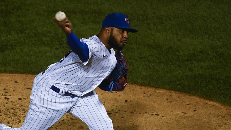 Sep 8, 2020; Chicago, Illinois, USA;  Chicago Cubs relief pitcher Jeremy Jeffress (24) delivers in the ninth inning against the Cincinnati Reds at Wrigley Field. Mandatory Credit: Matt Marton-USA TODAY Sports