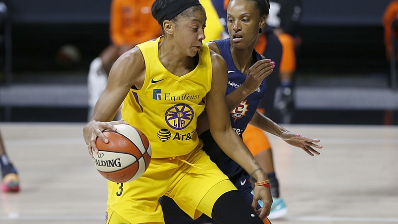 Sep 17, 2020; Palmetto, Florida, USA;  Los Angeles Sparks forward Candace Parker (3) drives past Connecticut Sun forward DeWanna Bonner (24) during the first half at the FELD entertainment complex. Mandatory Credit: Reinhold Matay-USA TODAY Sports