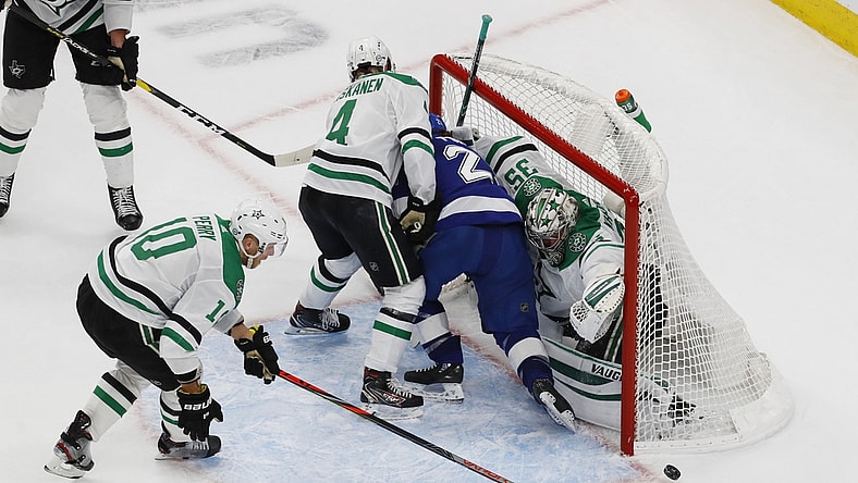 Sep 26, 2020; Edmonton, Alberta, CAN; Tampa Bay Lightning center Brayden Point (21) is shoved into the net of Dallas Stars goaltender Anton Khudobin (35) during overtime in game five of the 2020 Stanley Cup Final at Rogers Place. Mandatory Credit: Perry Nelson-USA TODAY Sports