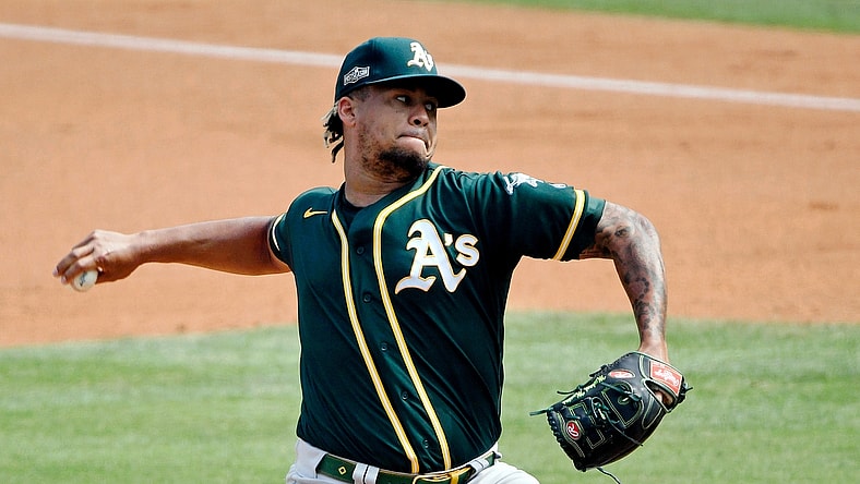 Oct 8, 2020; Los Angeles, California, USA; Oakland Athletics starting pitcher Frankie Montas (47) pitches against the Houston Astros during the first inning during game four of the 2020 ALDS at Dodger Stadium. Mandatory Credit: Robert Hanashiro-USA TODAY Sports