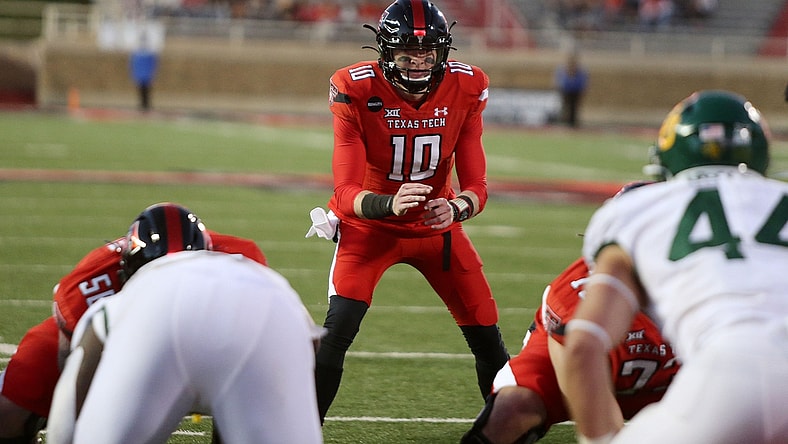 Nov 14, 2020; Lubbock, Texas, USA;  Texas Tech Red Raiders quarterback Alan Bowman (10) calls signals in the second half in the game against the Baylor Bears at Jones AT&T Stadium. Mandatory Credit: Michael C. Johnson-USA TODAY Sports