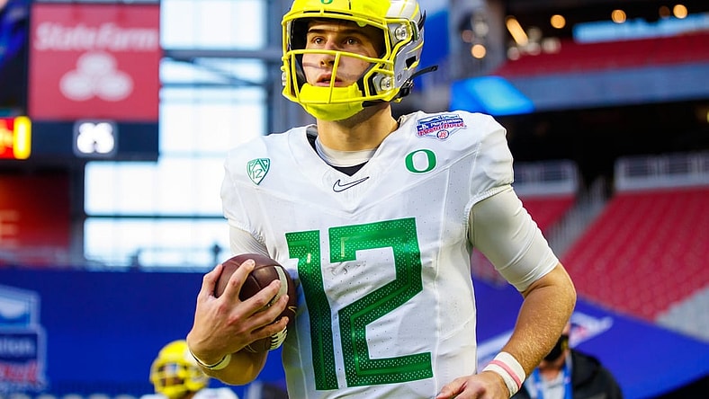 Jan 2, 2021; Glendale, AZ, USA; Oregon Ducks quarterback Tyler Shough (12) against the Iowa State Cyclones in the Fiesta Bowl at State Farm Stadium. Mandatory Credit: Mark J. Rebilas-USA TODAY Sports
