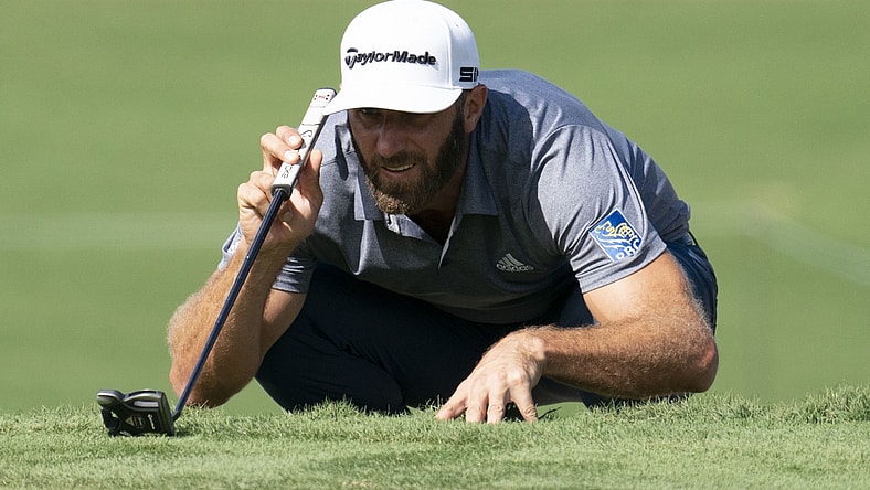 January 9, 2021; Maui, Hawaii, USA; Dustin Johnson lines up his putt on the third hole during the third round of the Sentry Tournament of Champions golf tournament at Kapalua Resort - The Plantation Course. Mandatory Credit: Kyle Terada-USA TODAY Sports