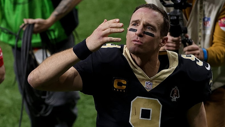 Jan 17, 2021; New Orleans, Louisiana, USA; New Orleans Saints quarterback Drew Brees (9) blows a kiss to his family as he walks to the tunnel following a 30-20 loss against the Tampa Bay Buccaneers in a NFC Divisional Round playoff game at the Mercedes-Benz Superdome. Mandatory Credit: Derick E. Hingle-USA TODAY Sports