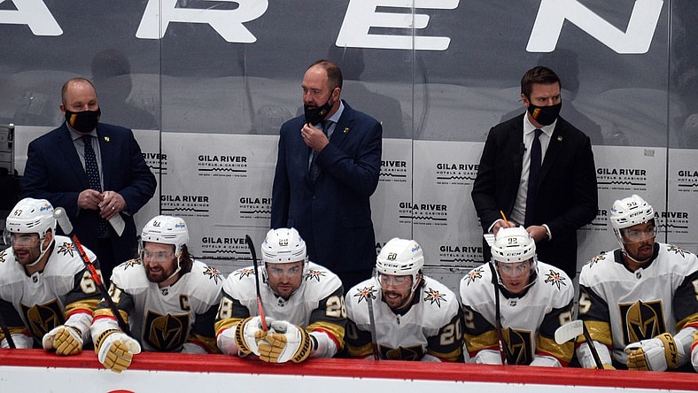 Jan 22, 2021; Glendale, Arizona, USA; Vegas Golden Knights head coach Peter DeBoer (center) looks on against the Arizona Coyotes during the first period at Gila River Arena. Mandatory Credit: Joe Camporeale-USA TODAY Sports