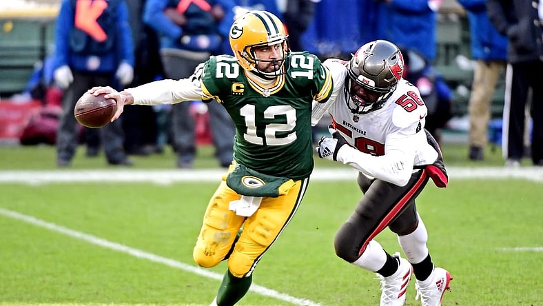 Tampa Bay Buccaneers outside linebacker Jason Pierre-Paul (90) sacks Green Bay Packers quarterback Aaron Rodgers (12) during the first quarter of their NFC Championship game