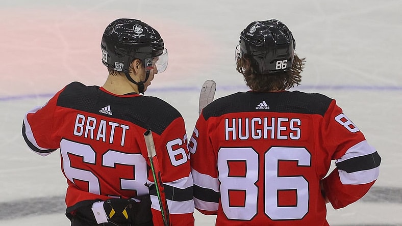 Jan 28, 2021; Newark, New Jersey, USA; New Jersey Devils left wing Jesper Bratt (63) and New Jersey Devils center Jack Hughes (86) talk during the third period of their game against the Philadelphia Flyers at Prudential Center. Mandatory Credit: Ed Mulholland-USA TODAY Sports