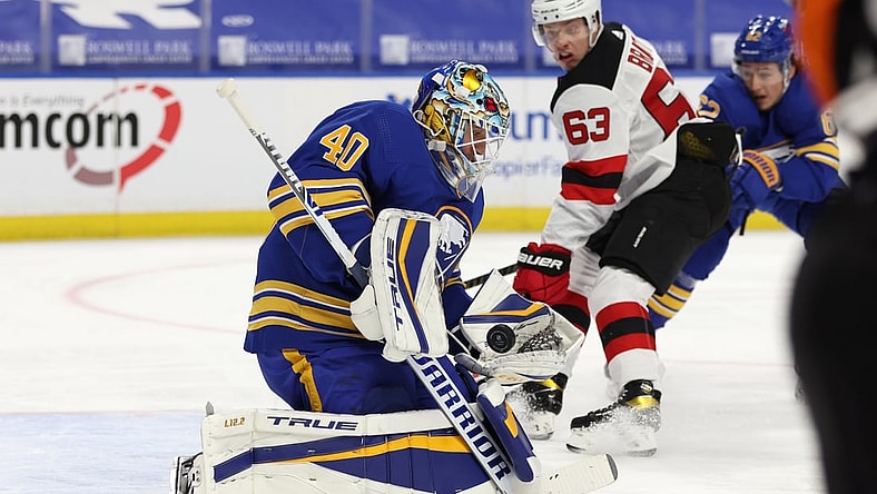 Jan 31, 2021; Buffalo, New York, USA; Buffalo Sabres goaltender Carter Hutton (40) makes a glove save during the third period against the New Jersey Devils at KeyBank Center. Mandatory Credit: Timothy T. Ludwig-USA TODAY Sports