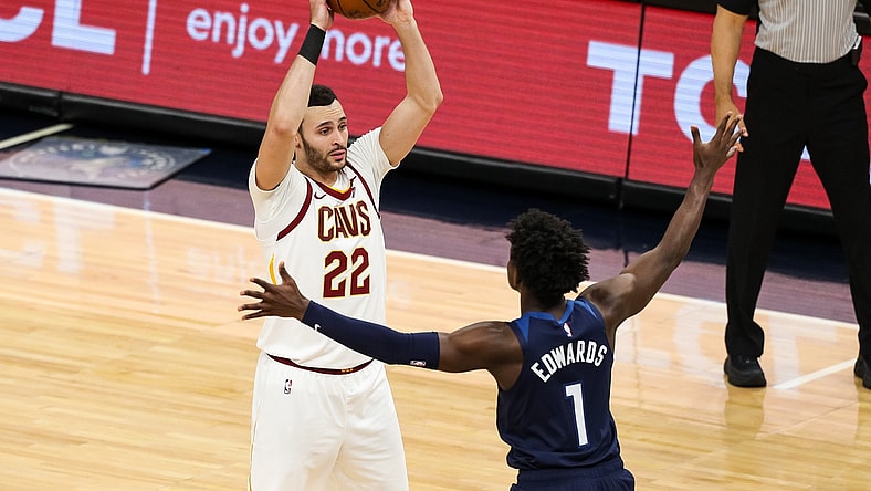 Jan 31, 2021; Minneapolis, Minnesota, USA; Cleveland Cavaliers forward Larry Nance Jr. (22) controls the ball against Minnesota Timberwolves guard Anthony Edwards (1) in the third quarter at Target Center. Mandatory Credit: David Berding-USA TODAY Sports