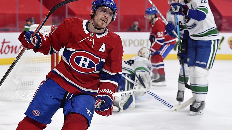 Feb 1, 2021; Montreal, Quebec, CAN; Montreal Canadiens forward Brendan Gallagher (11) reacts after scoring a goal against Vancouver Canucks goalie Braden Holtby (49) during the second period at the Bell Centre. Mandatory Credit: Eric Bolte-USA TODAY Sports