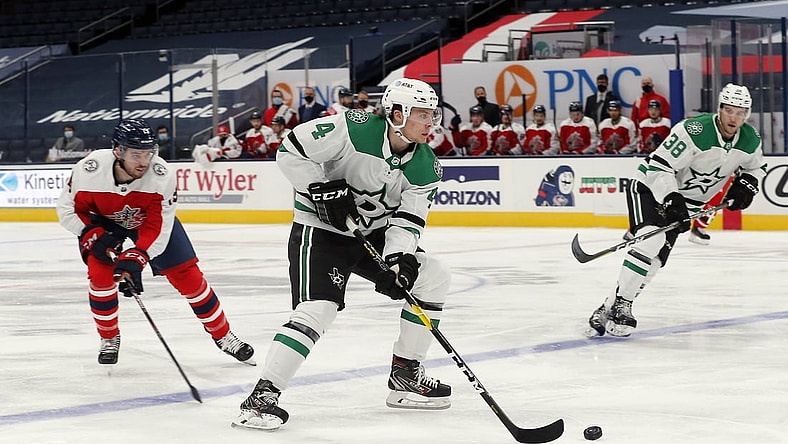 Feb 2, 2021; Columbus, Ohio, USA; Dallas Stars defenseman Miro Heiskanen (4) passes the puck against the Columbus Blue Jackets during the second period at Nationwide Arena. Mandatory Credit: Russell LaBounty-USA TODAY Sports
