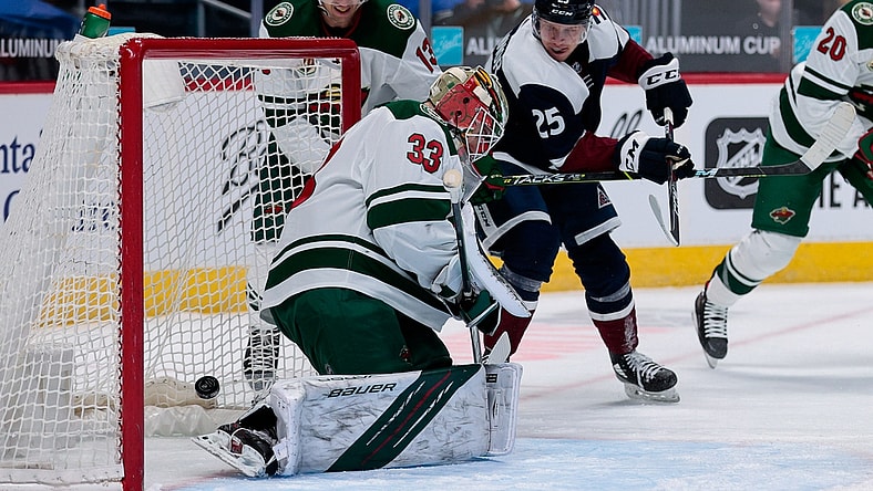 Feb 2, 2021; Denver, Colorado, USA; Colorado Avalanche right wing Logan O'Connor (25) scores past Minnesota Wild goaltender Cam Talbot (33) as center Nick Bonino (13) defends in the first period at Ball Arena. Mandatory Credit: Isaiah J. Downing-USA TODAY Sports