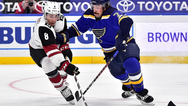Feb 2, 2021; St. Louis, Missouri, USA;  Arizona Coyotes center Nick Schmaltz (8) handles the puck as St. Louis Blues defenseman Justin Faulk (72) defends during the second period at Enterprise Center. Mandatory Credit: Jeff Curry-USA TODAY Sports