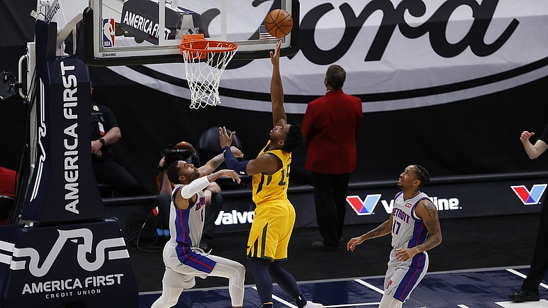 Feb 2, 2021; Salt Lake City, Utah, USA; Utah Jazz guard Donovan Mitchell (45) shoots against Detroit Pistons guard Wayne Ellington (8) in the first quarter at Vivint Smart Home Arena. Mandatory Credit: Jeffrey Swinger-USA TODAY Sports