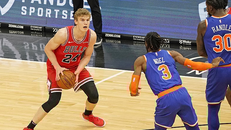 Feb 3, 2021; Chicago, Illinois, USA;  Chicago Bulls forward Lauri Markkanen (24) dribbles the ball against New York Knicks center Nerlens Noel (3) during the first quarter at the United Center. Mandatory Credit: Mike Dinovo-USA TODAY Sports