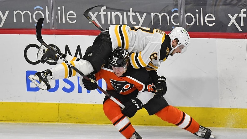 Feb 3, 2021; Philadelphia, Pennsylvania, USA; Philadelphia Flyers right wing Nicolas Aube-Kubel (62) checks Boston Bruins defenseman Jakub Zboril (67) during the first period at Wells Fargo Center. Mandatory Credit: Eric Hartline-USA TODAY Sports