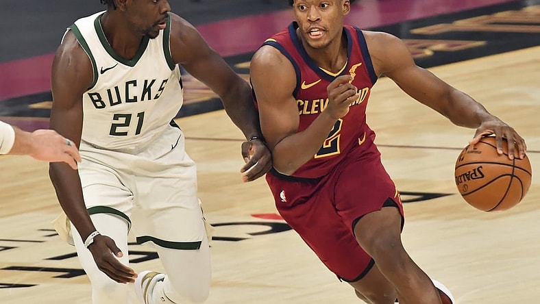 Feb 5, 2021; Cleveland, Ohio, USA;  Cleveland Cavaliers guard Collin Sexton (2) drives to the basket against Milwaukee Bucks guard Jrue Holiday (21) during the first quarter at Rocket Mortgage FieldHouse. Mandatory Credit: Ken Blaze-USA TODAY Sports