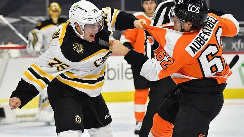 Feb 5, 2021; Philadelphia, Pennsylvania, USA; Boston Bruins defenseman Connor Clifton (75) and Philadelphia Flyers right wing Nicolas Aube-Kubel (62) exchange punches during the first period at Wells Fargo Center. Mandatory Credit: Eric Hartline-USA TODAY Sports