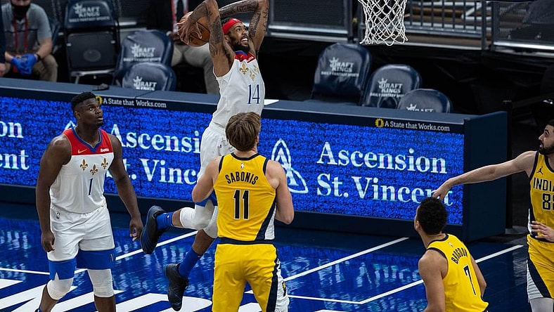 Feb 5, 2021; Indianapolis, Indiana, USA; New Orleans Pelicans forward Brandon Ingram (14) slam dunks the ball  in the second quarter against the Indiana Pacers at Bankers Life Fieldhouse. Mandatory Credit: Trevor Ruszkowski-USA TODAY Sports
