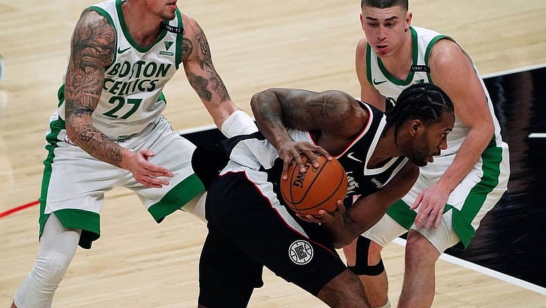 Feb 5, 2021; Los Angeles, California, USA; LA Clippers forward Kawhi Leonard (2) is defended by Boston Celtics center Daniel Theis (27) and guard Payton Pritchard (11)  in the second quarter at Staples Center. Mandatory Credit: Kirby Lee-USA TODAY Sports