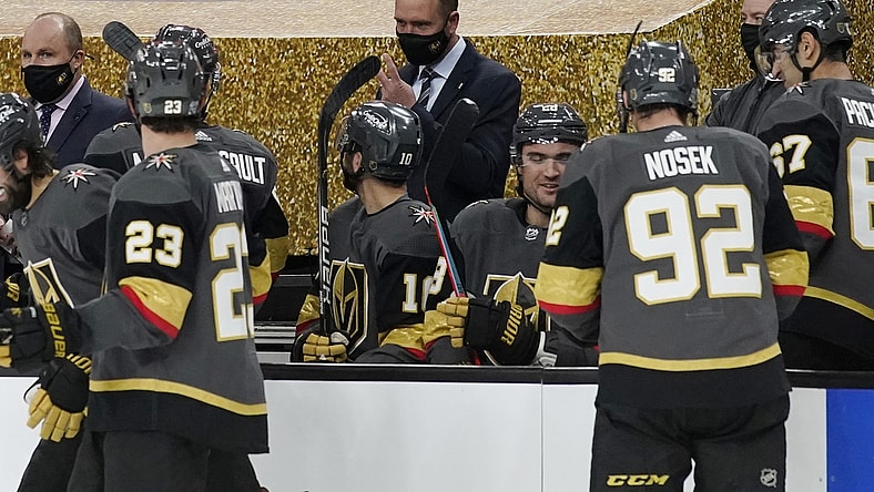 Feb 5, 2021; Las Vegas, Nevada, USA; Vegas Golden Knights head coach Peter DeBoer, center, speaks with his players during the second period of an NHL hockey game against the Los Angeles Kings, Friday, Feb. 5, 2021, in Las Vegas at T-Mobile Arena. Mandatory Credit: John Locher/Pool Photo-USA TODAY Sports