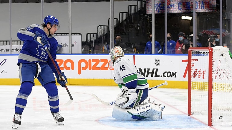 Feb 6, 2021; Toronto, Ontario, CAN; Toronto Maple Leafs forward Auston Matthews (34) scores against Vancouver Canucks goalie Braden Holtby (49) in the third period at Scotiabank Arena. Mandatory Credit: Dan Hamilton-USA TODAY Sports