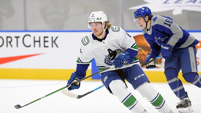 Feb 6, 2021; Toronto, Ontario, CAN;  Vancouver Canucks forward Brock Boeser (6) pursues the play ahead of Toronto Maple Leafs forward Mitchell Marner (16) in the first period at Scotiabank Arena. Mandatory Credit: Dan Hamilton-USA TODAY Sports