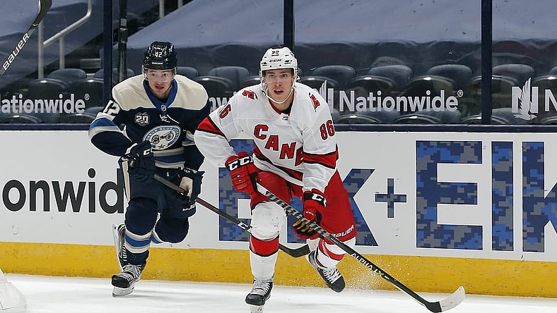 Feb 7, 2021; Columbus, Ohio, USA; Carolina Hurricanes left wing Teuvo Teravainen (86) carries the puck as Columbus Blue Jackets center Alexandre Texier (42) trails the play during the first period at Nationwide Arena. Mandatory Credit: Russell LaBounty-USA TODAY Sports