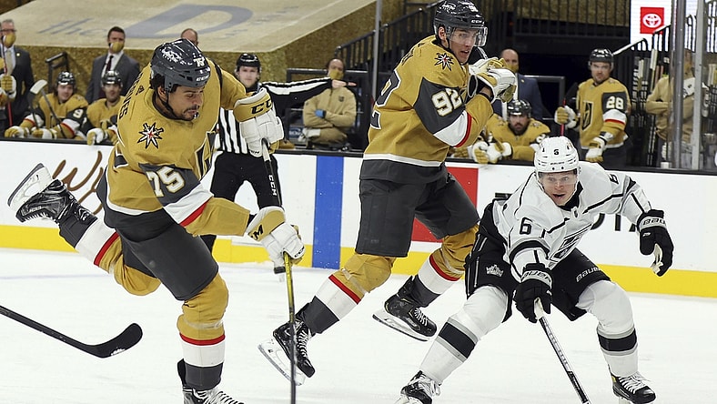 Feb 7, 2021; Las Vegas, NV, USA; Vegas Golden Knights right wing Ryan Reaves (75) shoots as Los Angeles Kings Olli Maatta (6) defends during the second period of an NHL hockey game Sunday, Feb. 7, 2021, in Las Vegas. Mandatory Credit: Isaac Brekken/Pool Photo-USA TODAY Sports