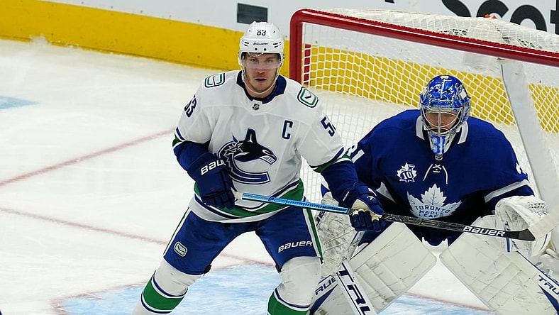 Feb 4, 2021; Toronto, Ontario, CAN; Vancouver Canucks forward Bo Horvat (53) tries to screen Toronto Maple Leafs goaltender Frederik Andersen (31) at Scotiabank Arena. Mandatory Credit: John E. Sokolowski-USA TODAY Sports