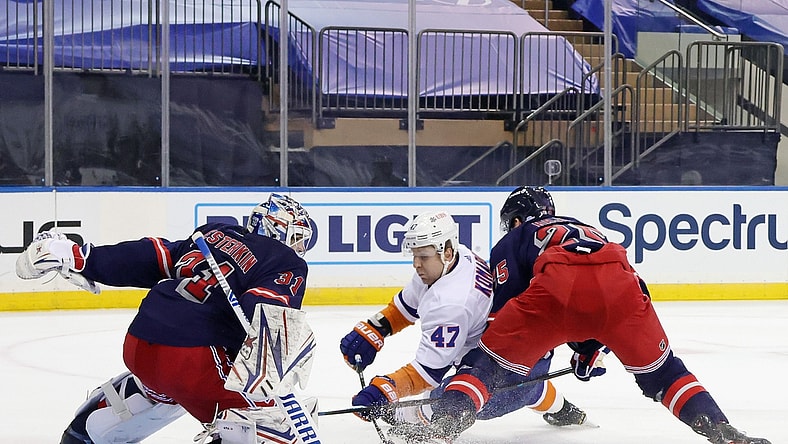 Feb 8, 2021; New York, NY, USA;  Igor Shesterkin #31 and Libor Hajek #25 of the New York Rangers combine to stop Leo Komarov #47 of the New York Islanders during the first period at Madison Square Garden on February 08, 2021 in New York City.  Mandatory Credit: Bruce Bennett/Pool Photo-USA TODAY Sports