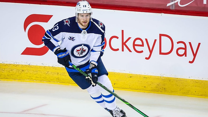 Feb 9, 2021; Calgary, Alberta, CAN; Winnipeg Jets center Pierre-Luc Dubois (13) warms up before the game against the Calgary Flames at Scotiabank Saddledome. Mandatory Credit: Sergei Belski-USA TODAY Sports
