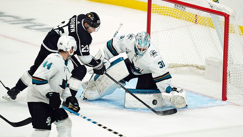 Feb 9, 2021; Los Angeles, California, USA; LA Kings right wing Dustin Brown (23) shoots the puck past San Jose Sharks goaltender Martin Jones (31) for a goal in the second period at Staples Center. Mandatory Credit: Kirby Lee-USA TODAY Sports